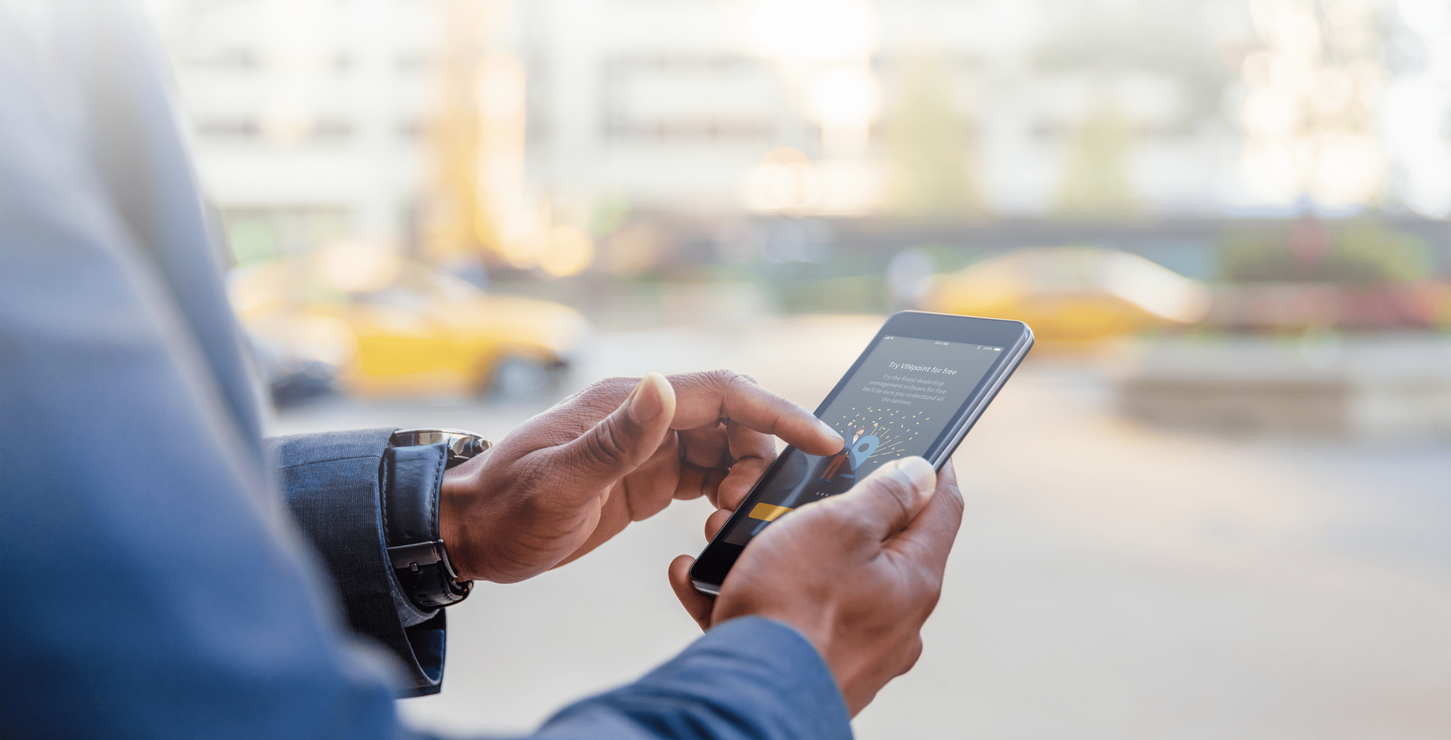Man using smartphone with Vinpoint app on the screen